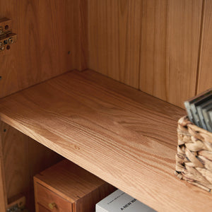 a wooden shelf with a basket on top of it