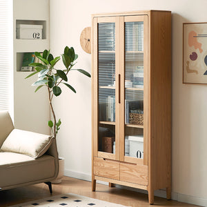 a living room with a couch and a wooden cabinet