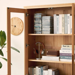 a bookshelf with a mirror and a clock on it