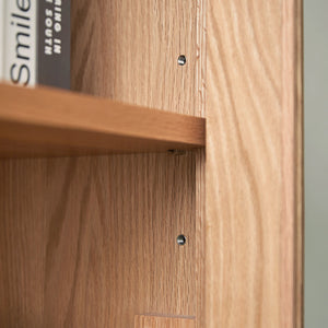 a wooden shelf with two books on it