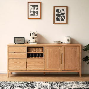 a room with a rug and a wooden cabinet