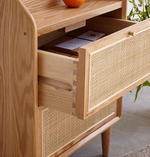 a close up of a drawer with a fruit on top of it