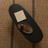 Top view of a black ash wood oval coffee table highlighting the elongated tabletop shape and dark wood grain.