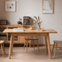 Natural solid oak extending dining table with rounded corners for flexible family dining spaces