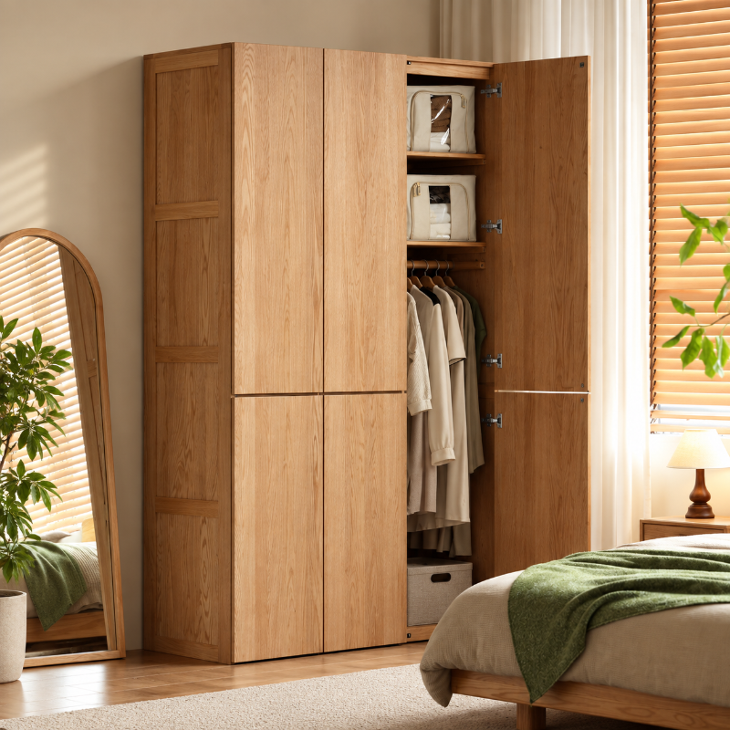 Clovis natural solid oak wardrobe with one door open showing hanging rail and storage shelves
