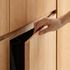 Close-up of Clovis natural oak wardrobe door handle design