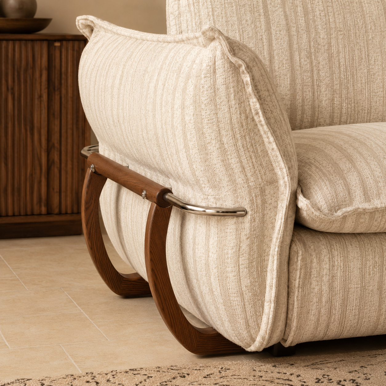 Cream striped fabric sofa with deep cushioned seating styled in a warm contemporary living room.