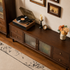 Top view of a dark wood TV unit showing the spacious wood surface and fluted glass cabinet doors.