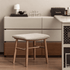 Graz walnut dressing stool with beige cushion, tapered legs and crossbar support