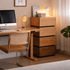 Herman Mix Timber Modular Chest of Drawers styled beside a home office desk with layered wood finishes and black shadow gaps.
