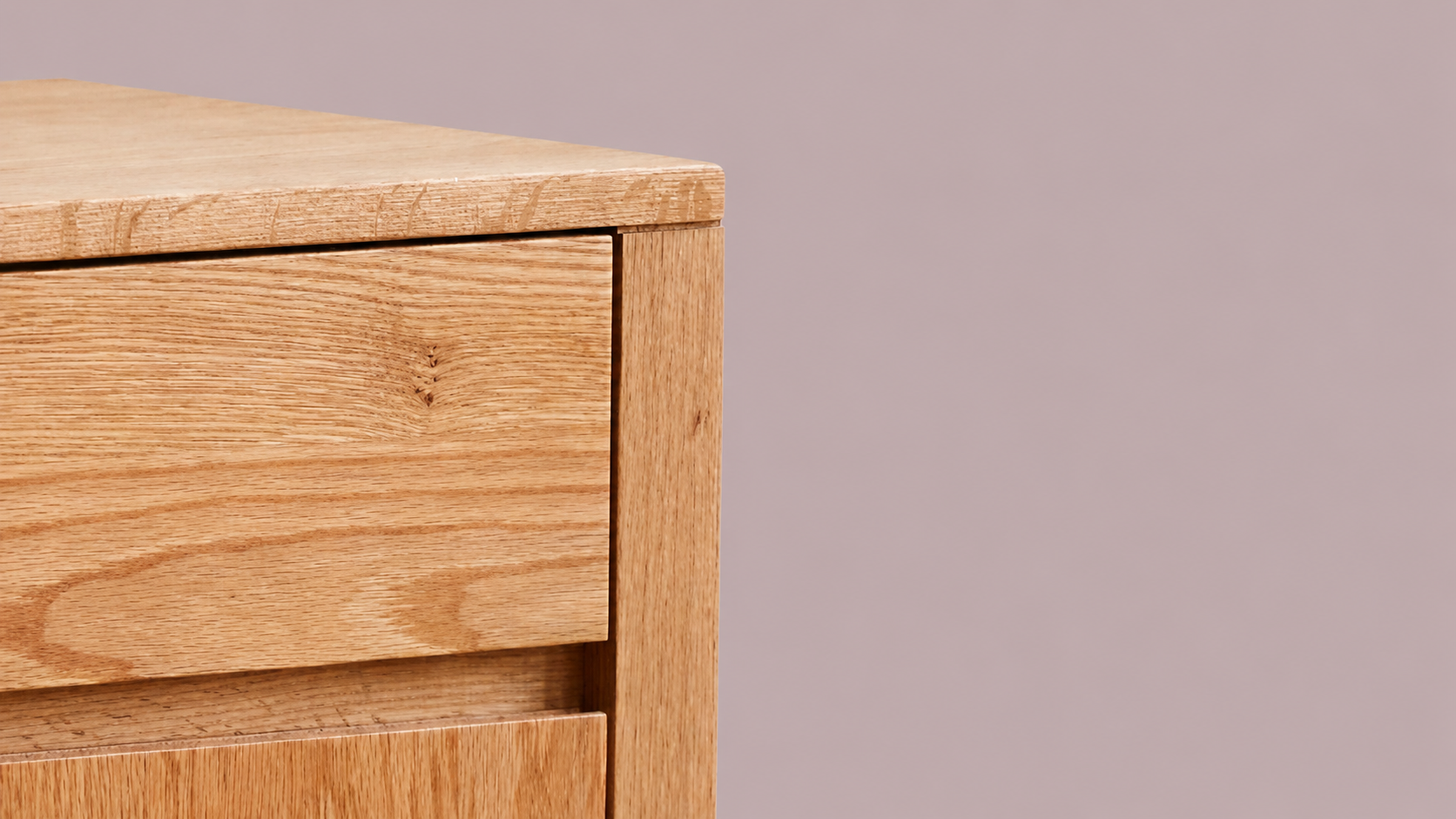 Close-up of the Humbie Natural Oak Furniture Collection showing natural oak grain, clean cabinet lines, and warm modern craftsmanship