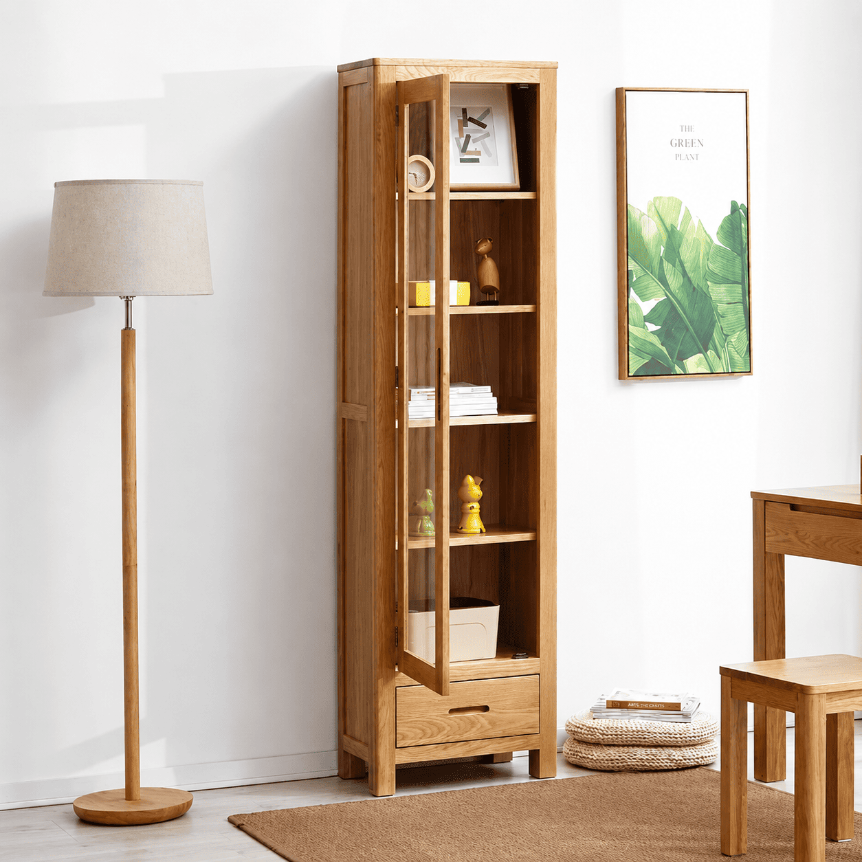 Humbie Solid Oak Slim Display Cabinet with open glass door, adjustable shelves and drawer storage for books and décor.