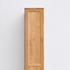 Side view of Humbie Solid Oak Slim Display Cabinet showing natural oak grain, solid wood panel and slim vertical design.