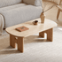 Irving natural oak coffee table with rounded rectangular ceramic top and sculptural wooden legs