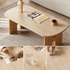 Front view of Irving natural solid oak coffee table with pale ceramic top and rounded edges