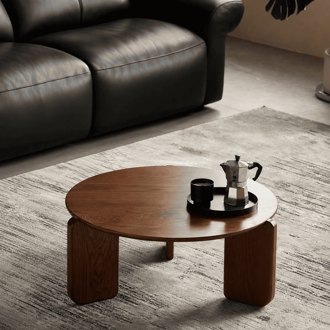Jelling round solid oak coffee table in walnut colour with wide curved legs