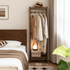 Lahti natural solid walnut compact coat rack showing 50 cm width in bedroom setting