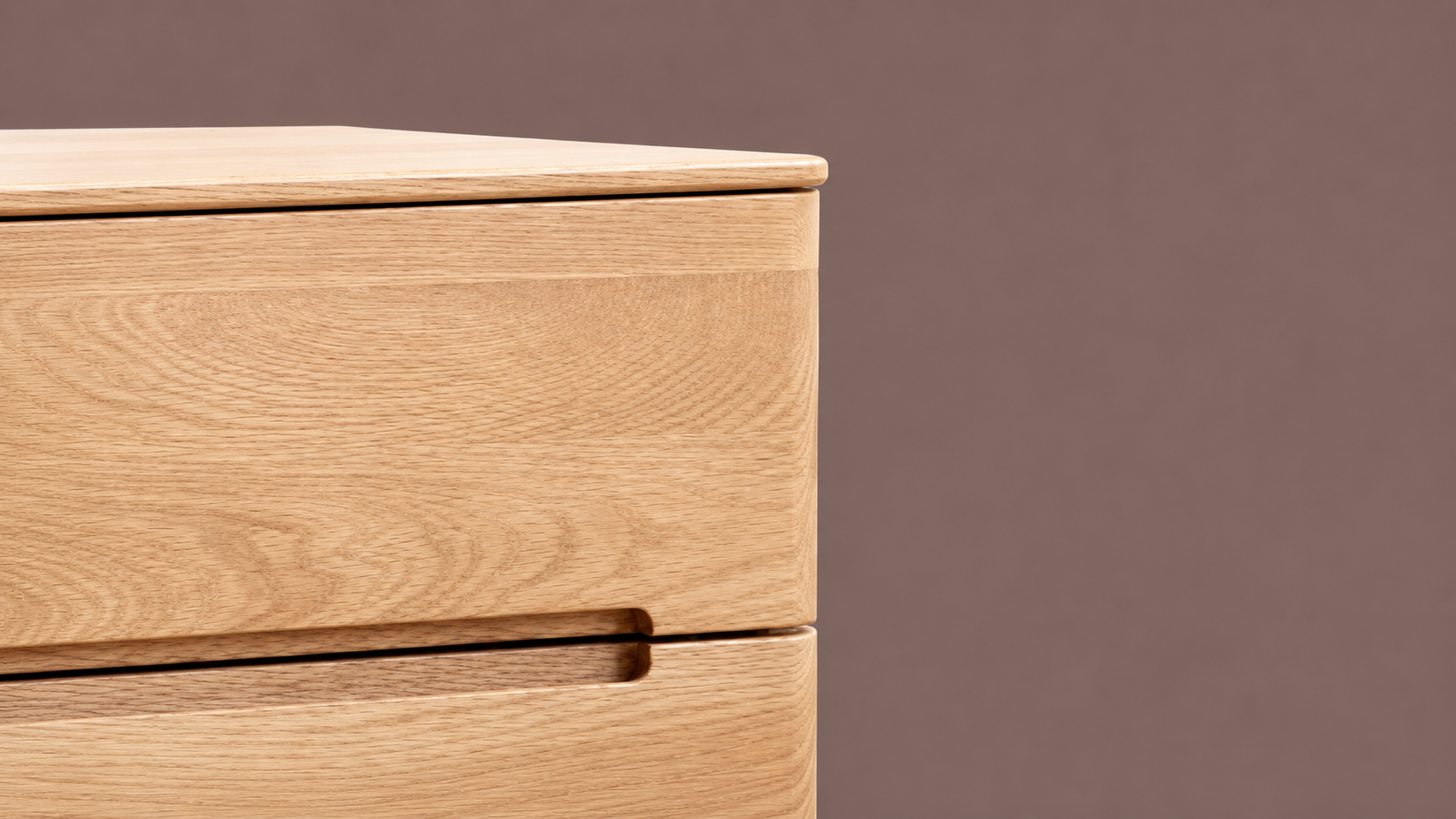 Close-up of the Manchester Natural Oak Furniture Collection showing smooth rounded drawer edges, recessed handle detail, and natural oak wood grain