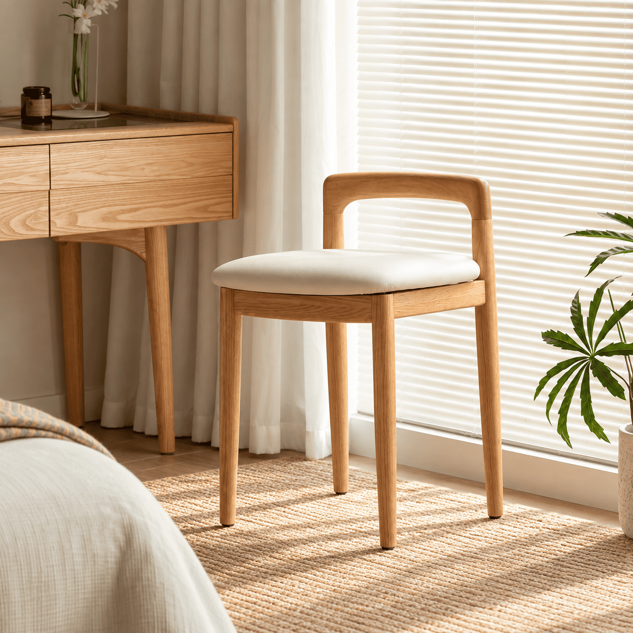 Nampa natural solid oak dressing stool styled beside a dressing table with cream cushion and curved backrest
