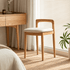 Nampa natural solid oak dressing stool styled beside a dressing table with cream cushion and curved backrest