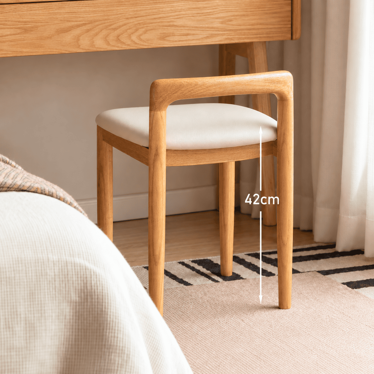 Nampa solid oak stool with cream upholstery and rounded wooden backrest shown from above