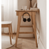Scandinavian-style wooden side table with a single drawer and solid oak construction for versatile home use.