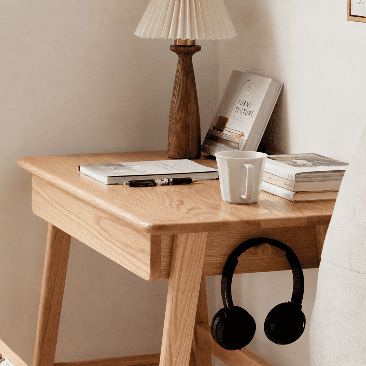 Modern oak bedside table featuring a storage drawer, open leg design, and natural wood finish.