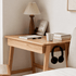 Solid oak side table with a built-in drawer and compact design for bedrooms or living spaces.