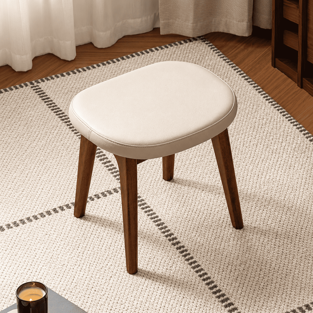 Norman cream upholstered solid walnut stool with rounded cushion and tapered wooden legs