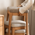 Contemporary oak nesting stools with fabric-cushioned seats, ideal for flexible seating and easy storage.