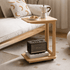 Natural oak mobile side table featuring a spacious top and open shelf for storage.