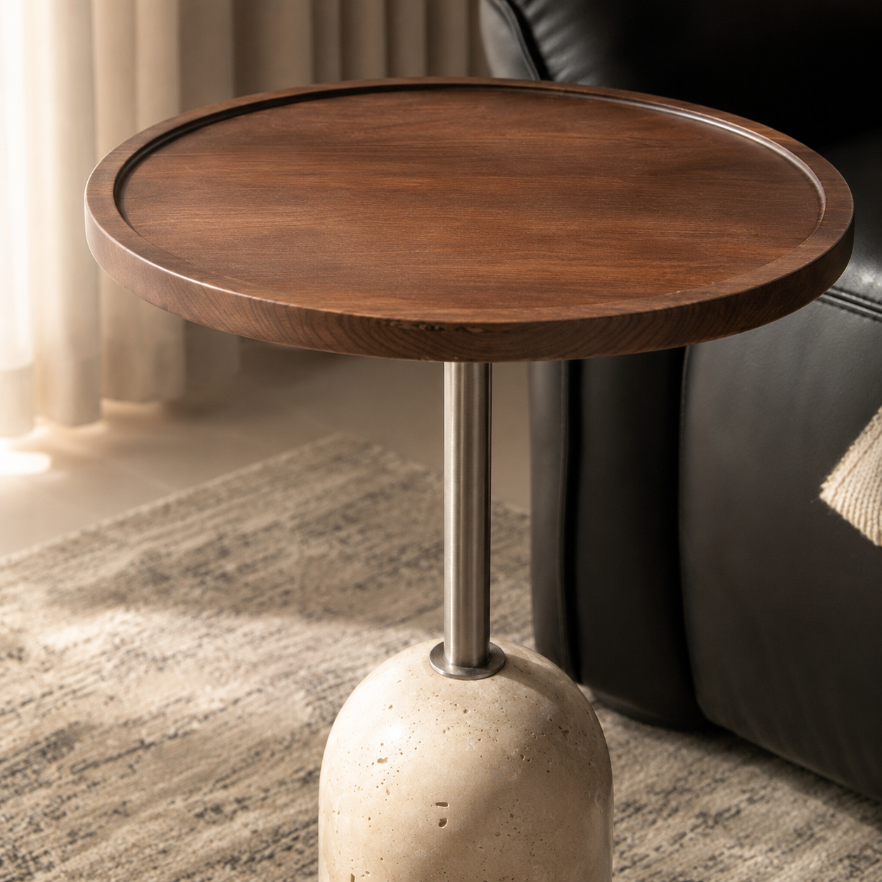 Close-up of the round walnut tabletop showing natural wood grain and a raised edge.