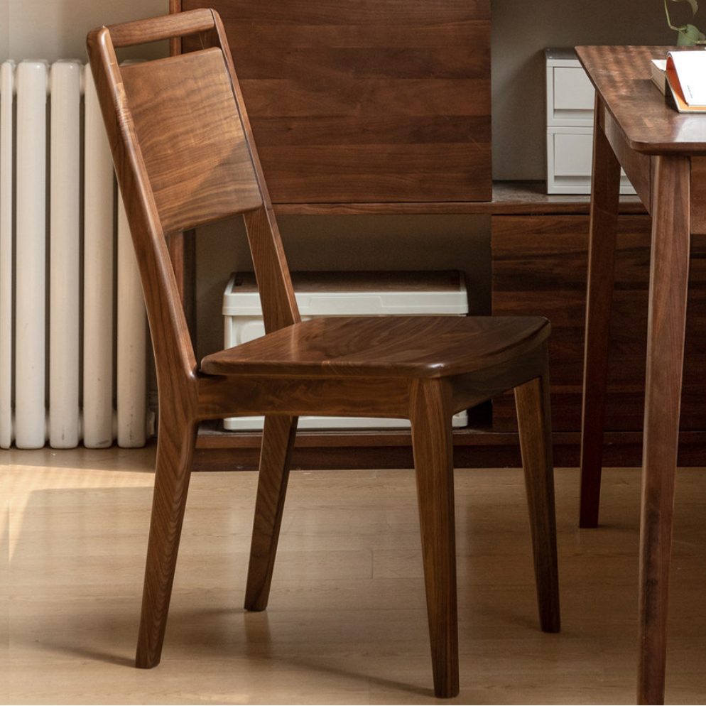 Solid walnut dining chair with simple silhouette for dining room, café-style seating, and open-plan homes