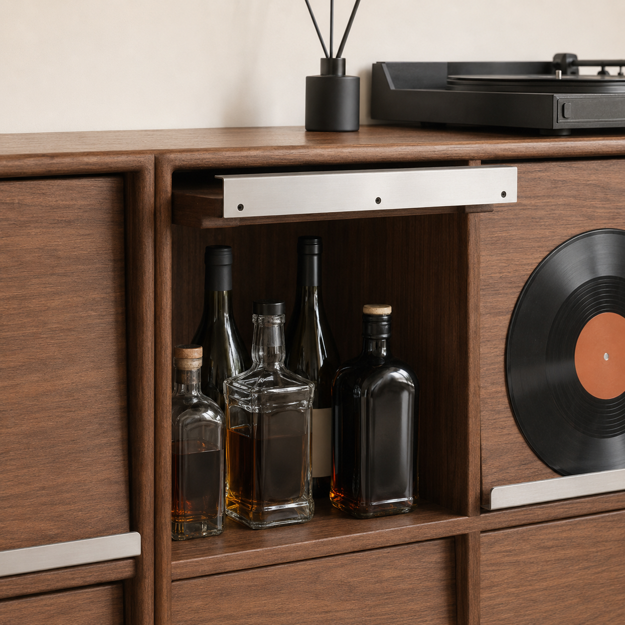 Close-up of walnut storage cabinet showing open bottle storage and brushed metal rail details.