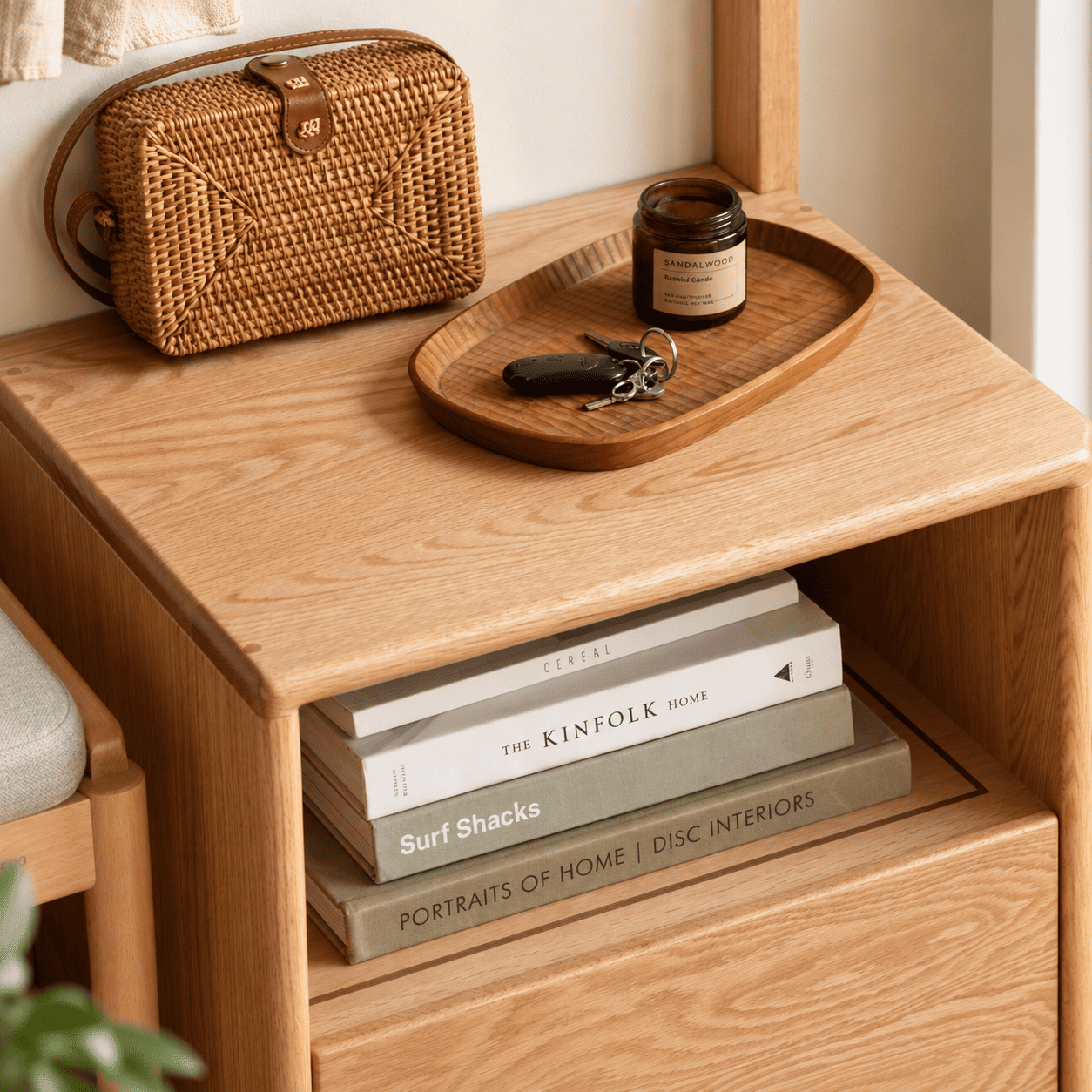 Close up of Warburg solid oak coat rack top hooks, rounded frame and natural wood grain