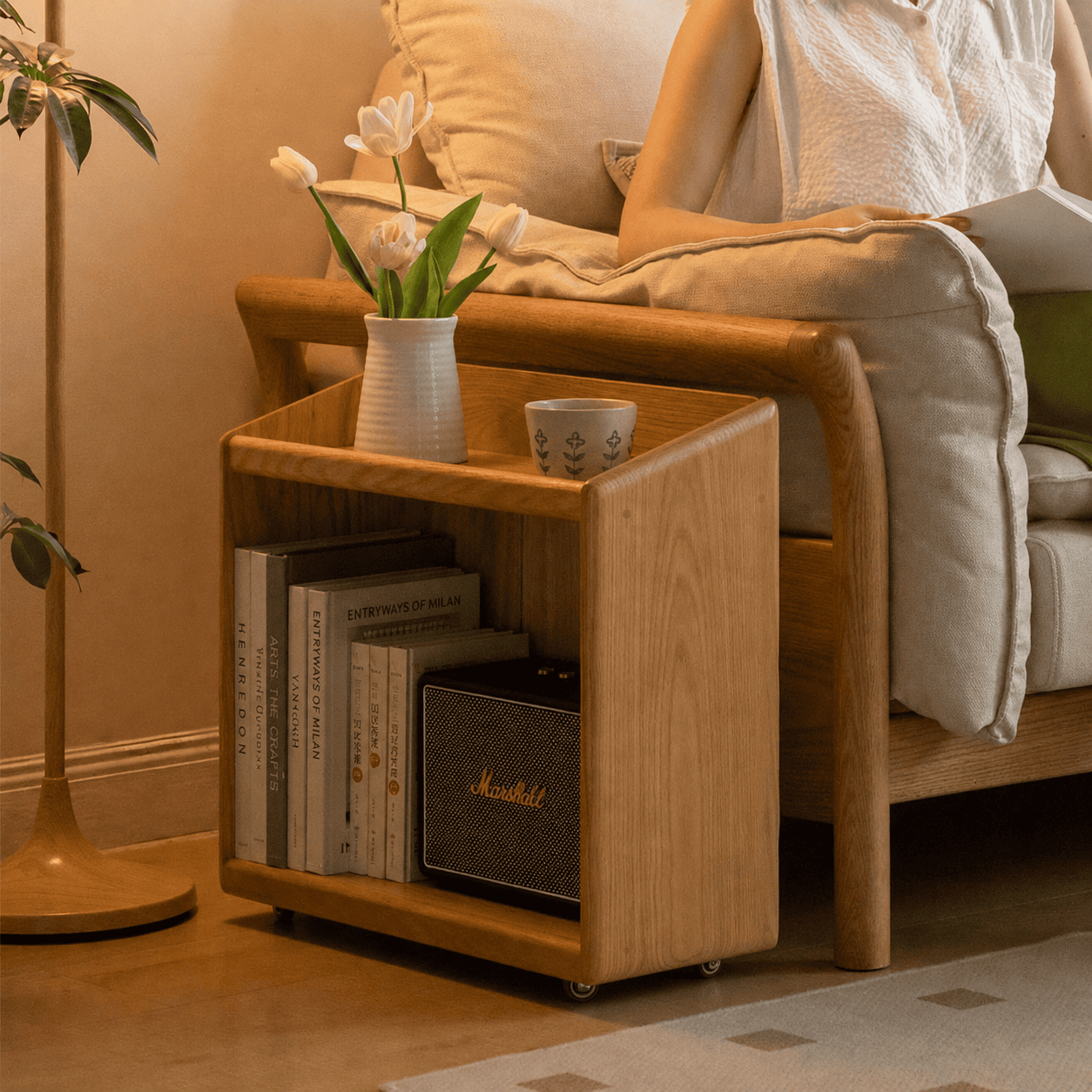 Compact wooden storage trolley with open shelving and smooth-rolling casters for versatile use.