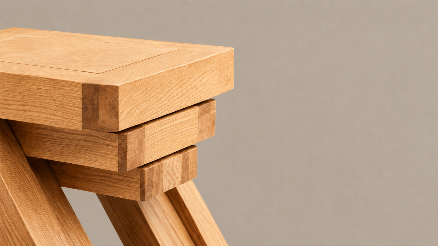 Close-up of the Zetland Natural Oak Furniture Collection showing layered oak joinery, detailed wood grain, and bold modern craftsmanship