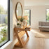Natural solid oak console table paired with round wall mirror for stylish hallway décor