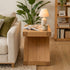 Natural oak sofa side table styled in a cosy lounge room with lamp and décor