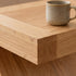 Natural oak lamp table with sculptural Z-shaped base for modern living room furniture