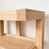 Natural oak open bookshelf for displaying books, baskets, plants, and home décor