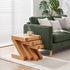 Natural oak nest of tables styled with coffee cup, sofa, and indoor plant in a cosy living room