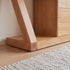 Natural solid oak sideboard cabinet styled with home décor, plants, and tableware storage