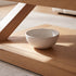 Zetland Natural Solid Oak Small Coffee Table styled in a bright modern living room with sofa and indoor plant