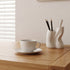 Zetland oak home office desk paired with cane chair and matching solid oak bookshelf